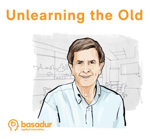 Caricature of Min Basadur PhD with Basadur Applied Innovation Centre in the background.